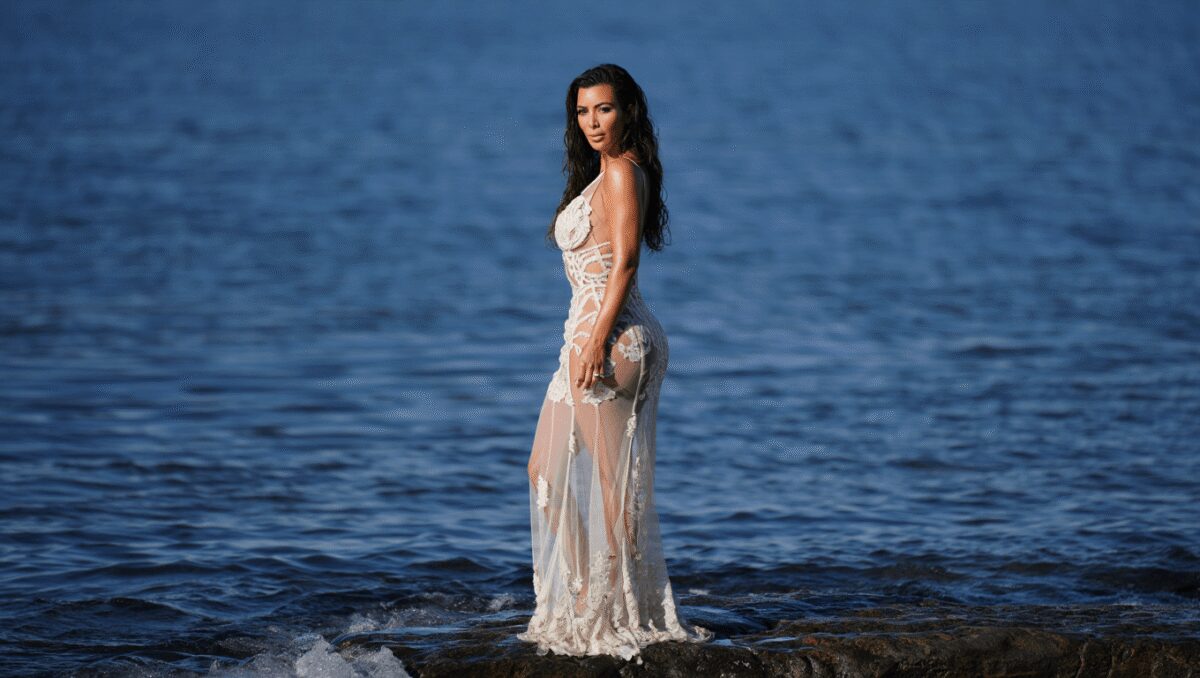 Kim Kardashian Stuns in Naked Dress as She Poses in Sheer Lace Outfit Next to the Sea