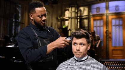 Colin Jost Is Nearly Forced to Shave His ‘Award-Winning Hair’ During ‘Saturday Night Live’ Joke Swap