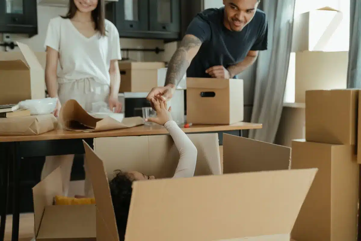 Parents helping their son move into a college dorm room