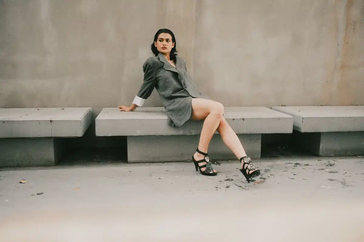 Woman wearing kitten heels walking on a city street