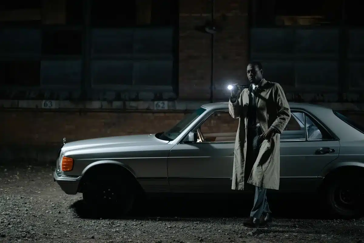 A police cruiser on an empty road at dusk, creating tension