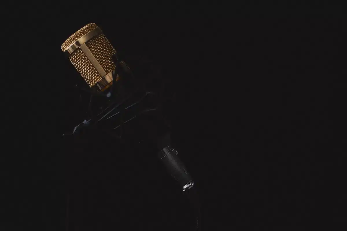 Solo musician recording at home with piano and microphone