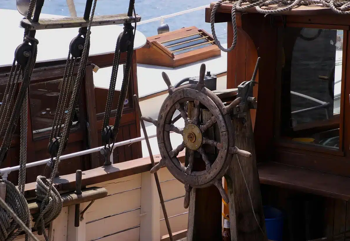 Deckhands handling a tender and watersports gear on a yacht