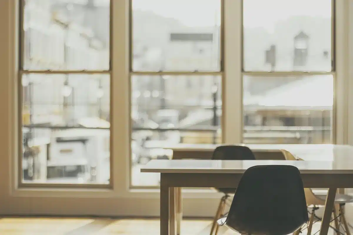 Empty study room with books and a lone chair, suggesting missing characters and absent subplots