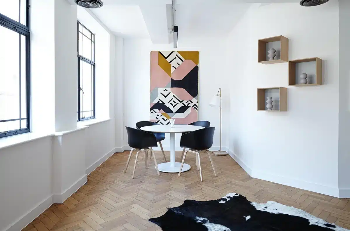 Two adults in conversation in a living room, negotiating and setting boundaries