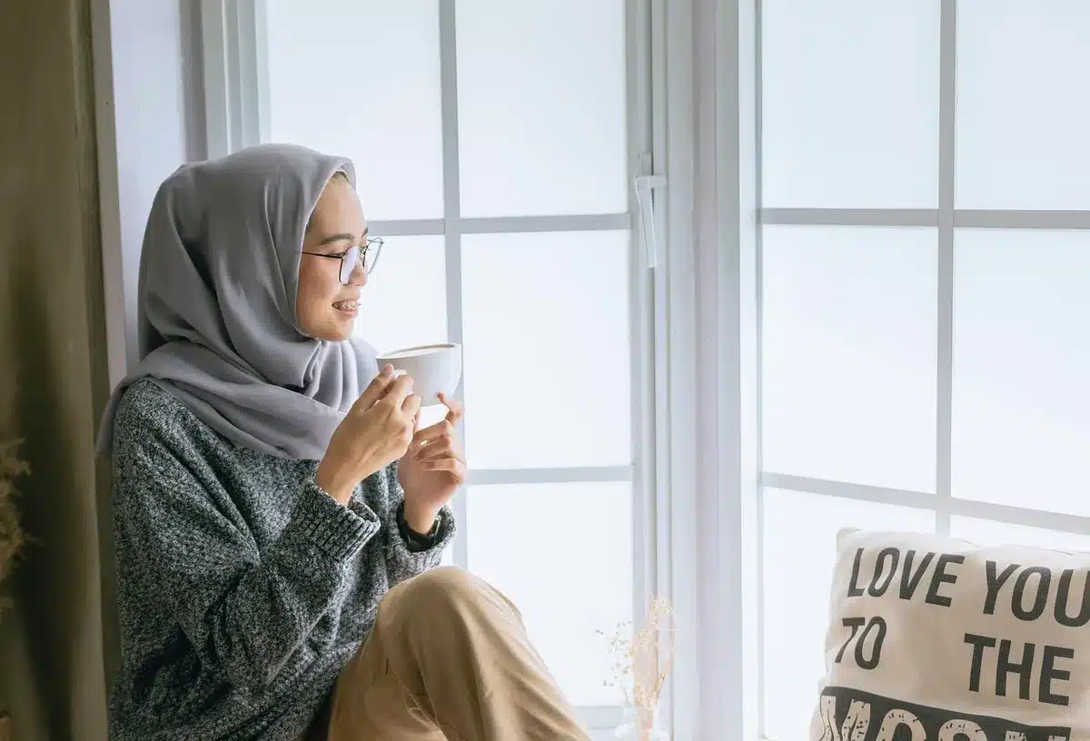 Deep coffee button-up cardigan layered over a top