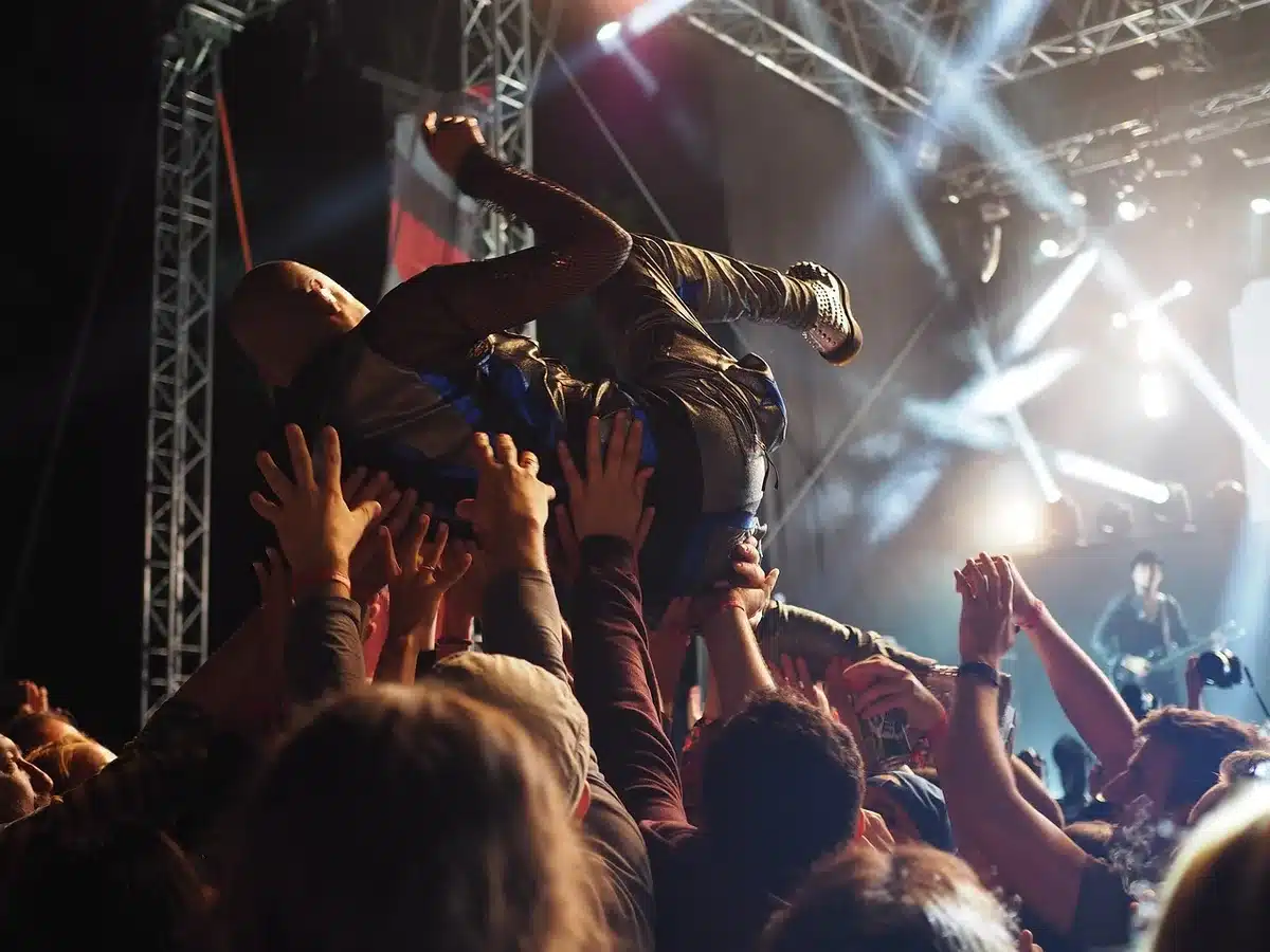 Veteran female band performing on stage, crowd singing along
