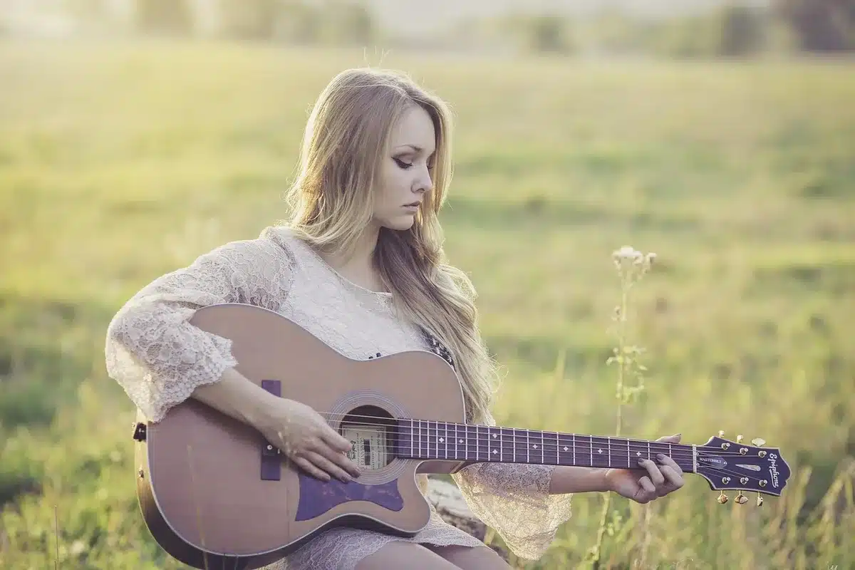 Acoustic guitar and a handwritten setlist on a small stage, suggesting a rare encore