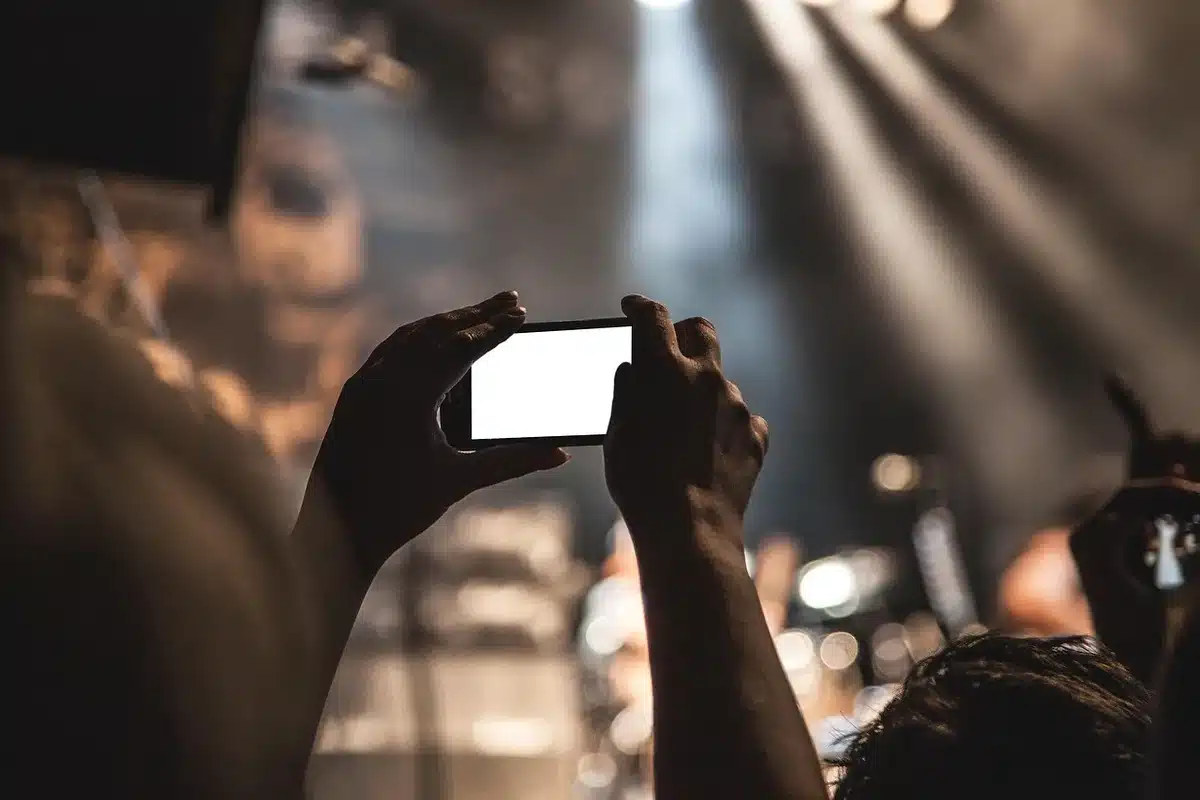 Anonymous performer pausing on stage to address a stadium audience
