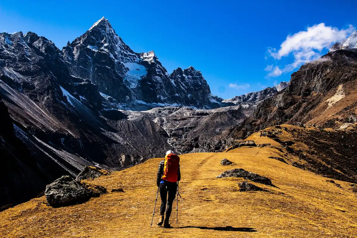 High-altitude base camp tents and snowy Himalayan peaks