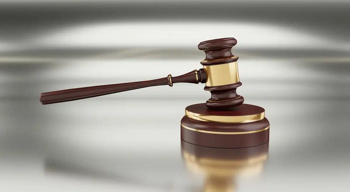 Gavel and legal files on a courthouse desk