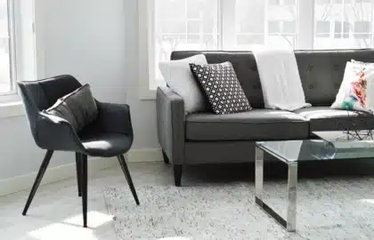 Vintage living room with videotapes, notebook and sneakers on a coffee table